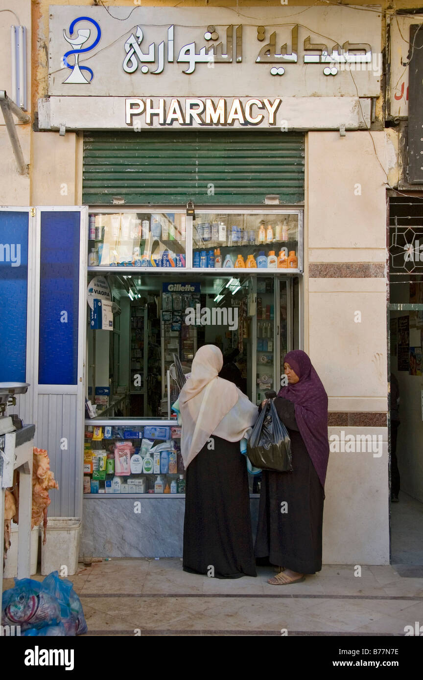 Women in front of a pharmacy, Aswan, Egypt, Africa Stock Photo