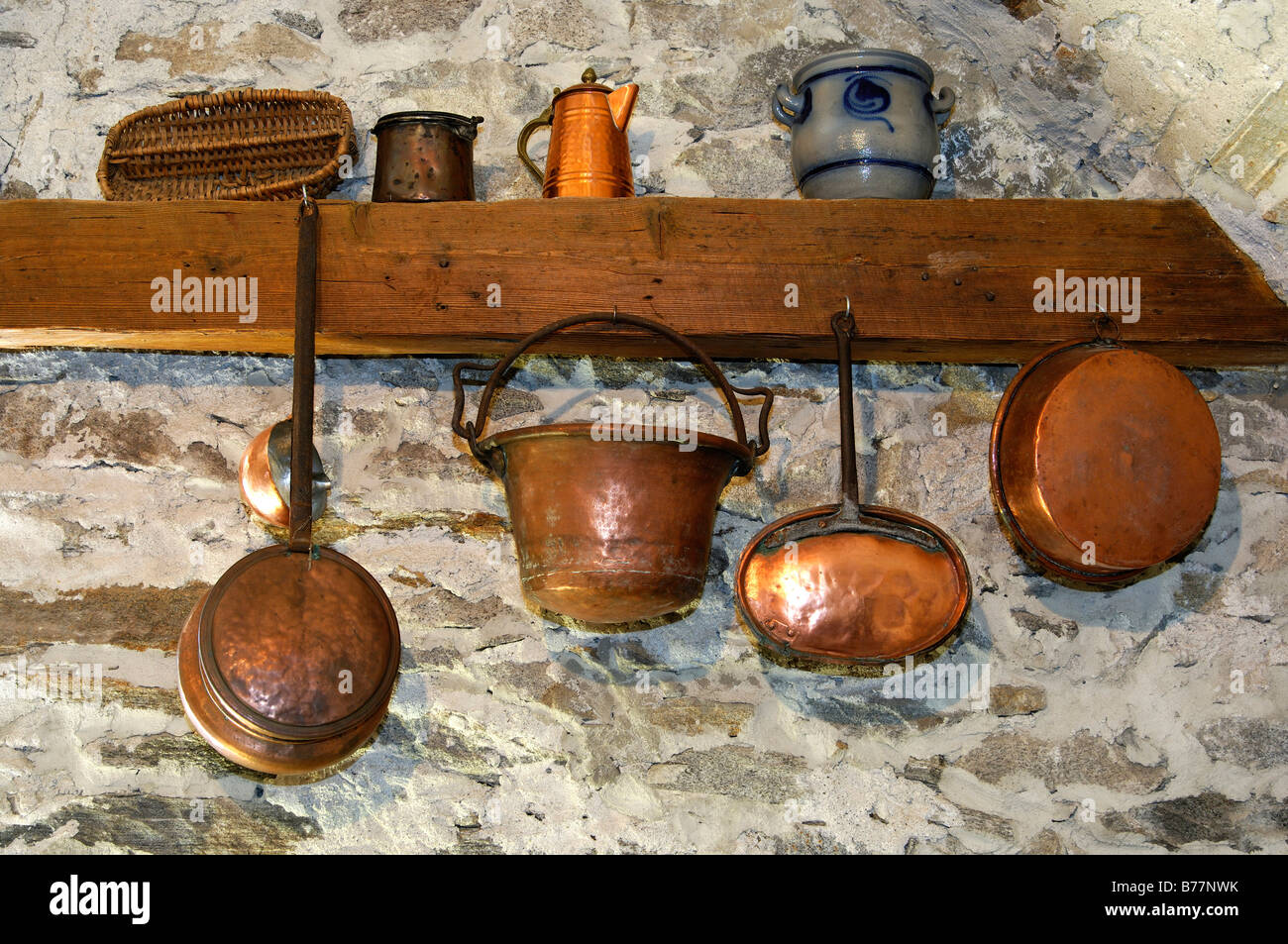 Copper kettles, copper pans and other crockery in a farmhouse in Tessin, Switzerland, Europe Stock Photo