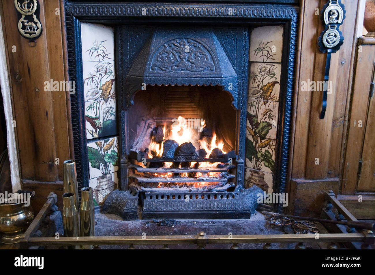 open traditional coal fire with horse brasses in a pub Stock Photo Alamy