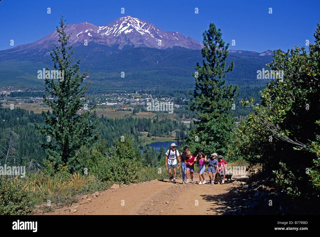 Hikers on Rainbow Ridge trail near Mt. Shasta California Stock Photo
