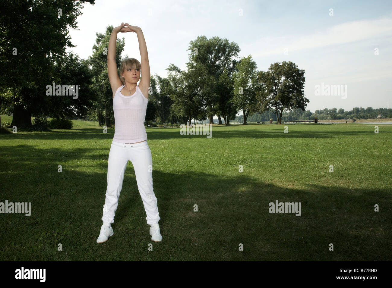Blonde woman in white tracksuit hi-res stock photography and images - Alamy