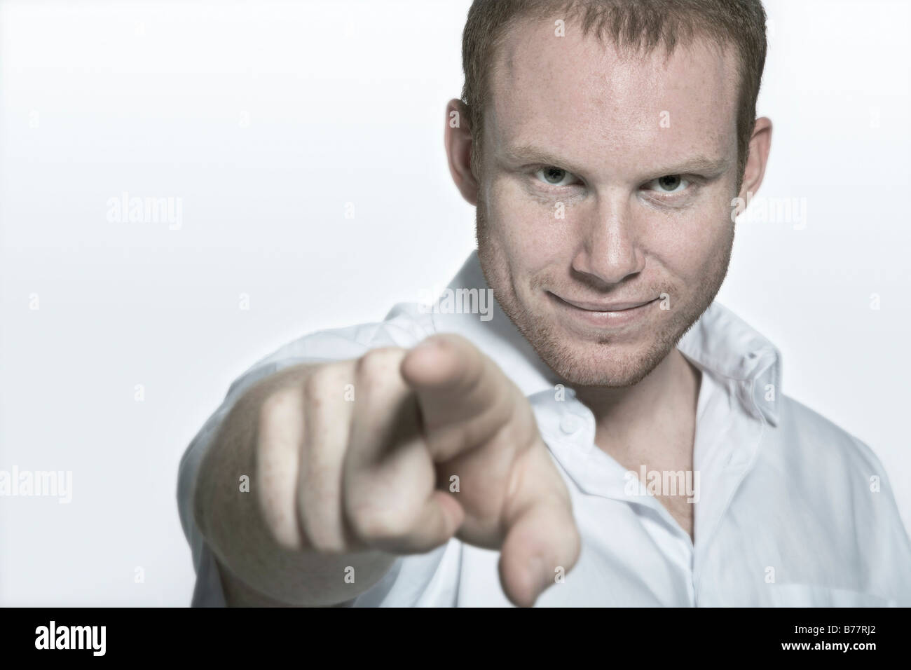 Young man pointing into the camera Stock Photo
