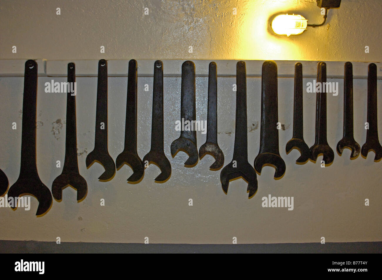 Spanners hung on wall in Maginot Line concrete bunker in France, Europe Stock Photo