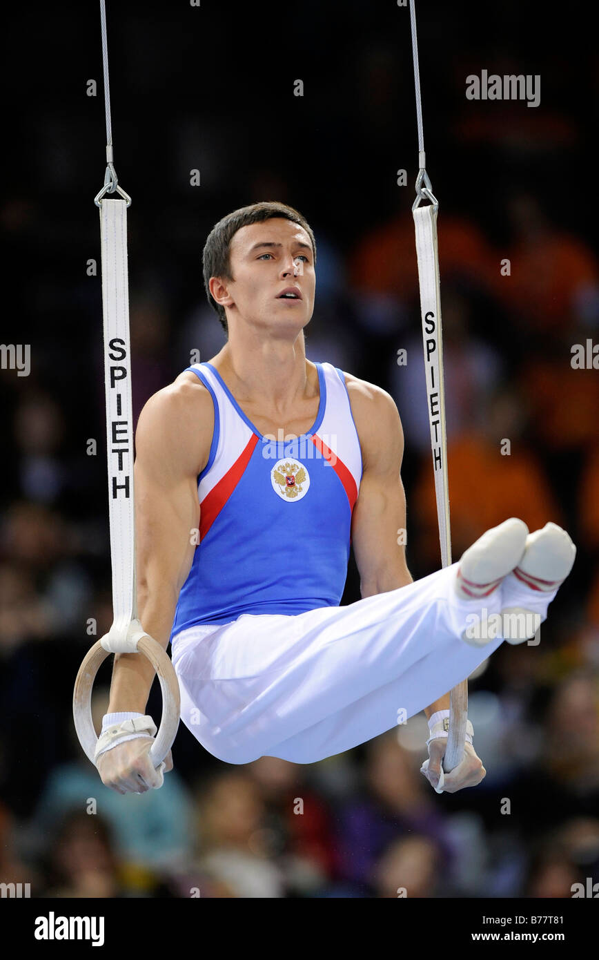 Maxim Deviatovski, Russia, performing an L-sit on the rings, Gymnastics World Cup Stuttgart 2008, Baden-Wuerttemberg, Germany,  Stock Photo