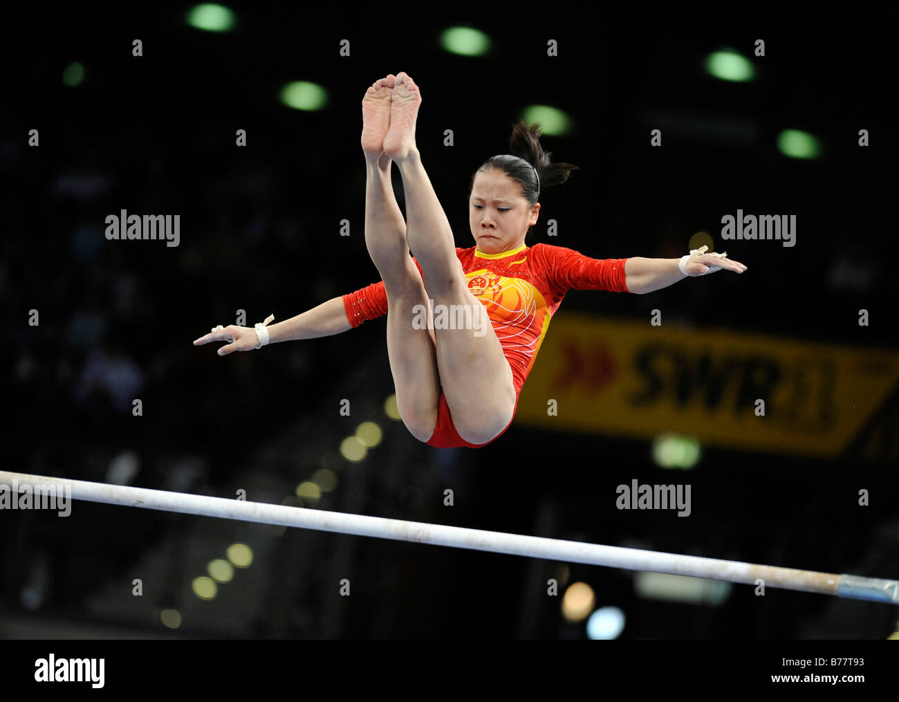 Fei Cheng, China, performing on the asymmetric bars, Gymnastics World Cup Stuttgart 2008, Baden-Wuerttemberg, Germany, Europe Stock Photo