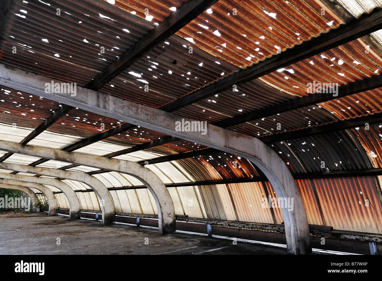 Corrugated roof made of plastic, holes caused by hail, brown Stock