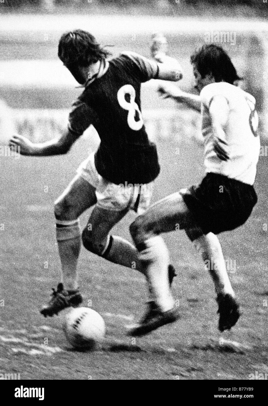 Brian Little of Aston Villa Football Clubs is tackled by Jimmy Case of Liverpool FC in a First Division game at Villa Park. Stock Photo