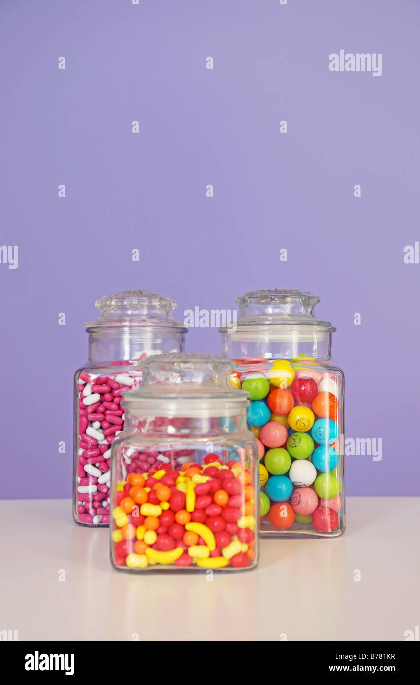 candy jars candy store good n plenty runts gumballs colorful sweets treats cavities jar three vertical image choice nutrition Stock Photo
