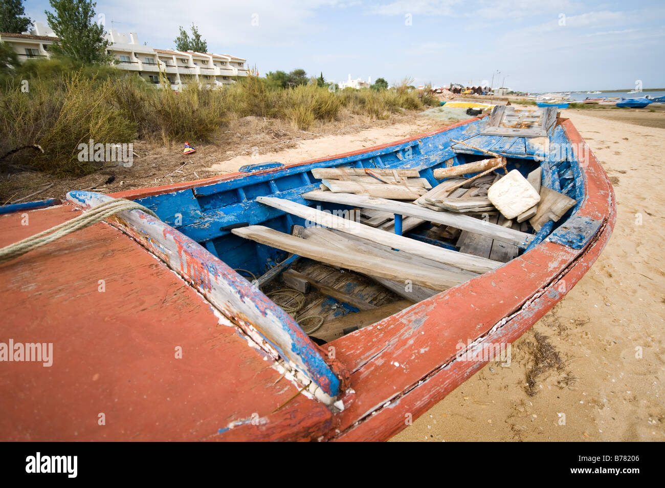 Old fishing boat on beach Stock Photo - Alamy