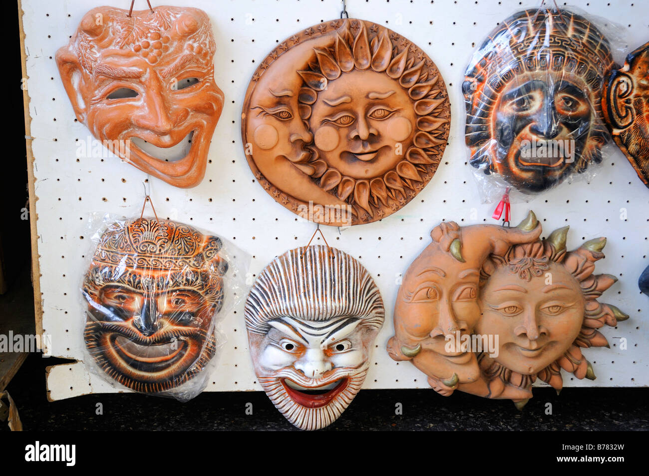 Typical Sicilian Pottery masks on sale at Greek theatre site in Siracuse Sicily Stock Photo