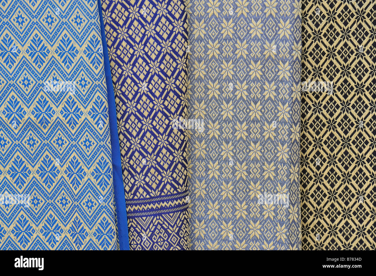 Thai silk hanging in a stall on a market Stock Photo Alamy