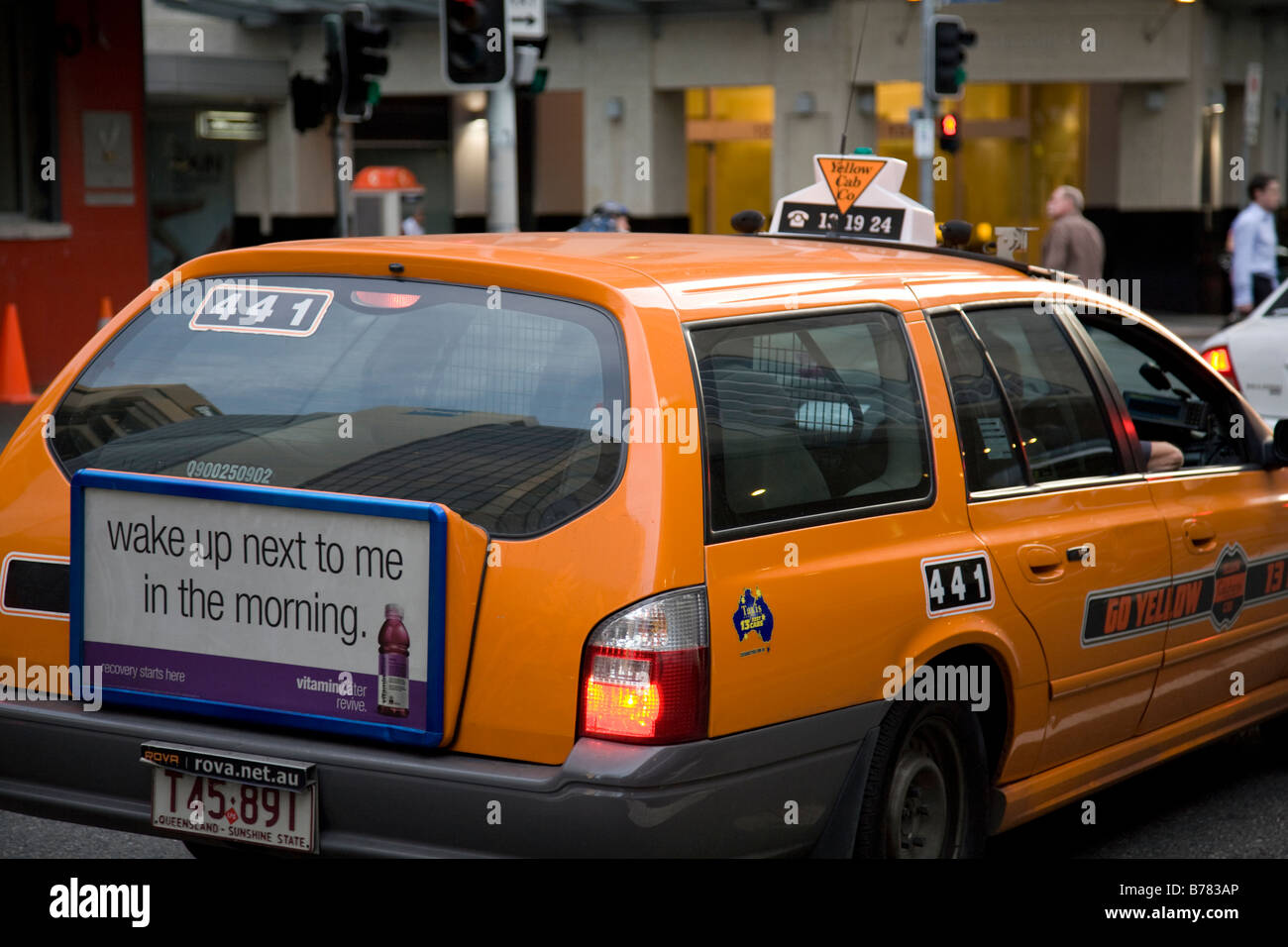 Brisbane orange taxi car in the city centre,Queensland,Australia Stock Photo