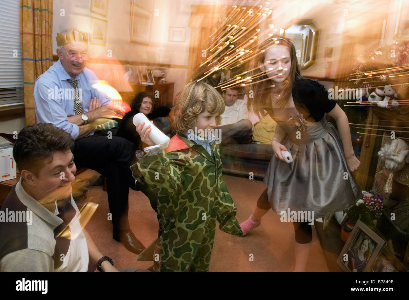 a family playing with the Nintendo Wii at christmas Stock Photo Alamy
