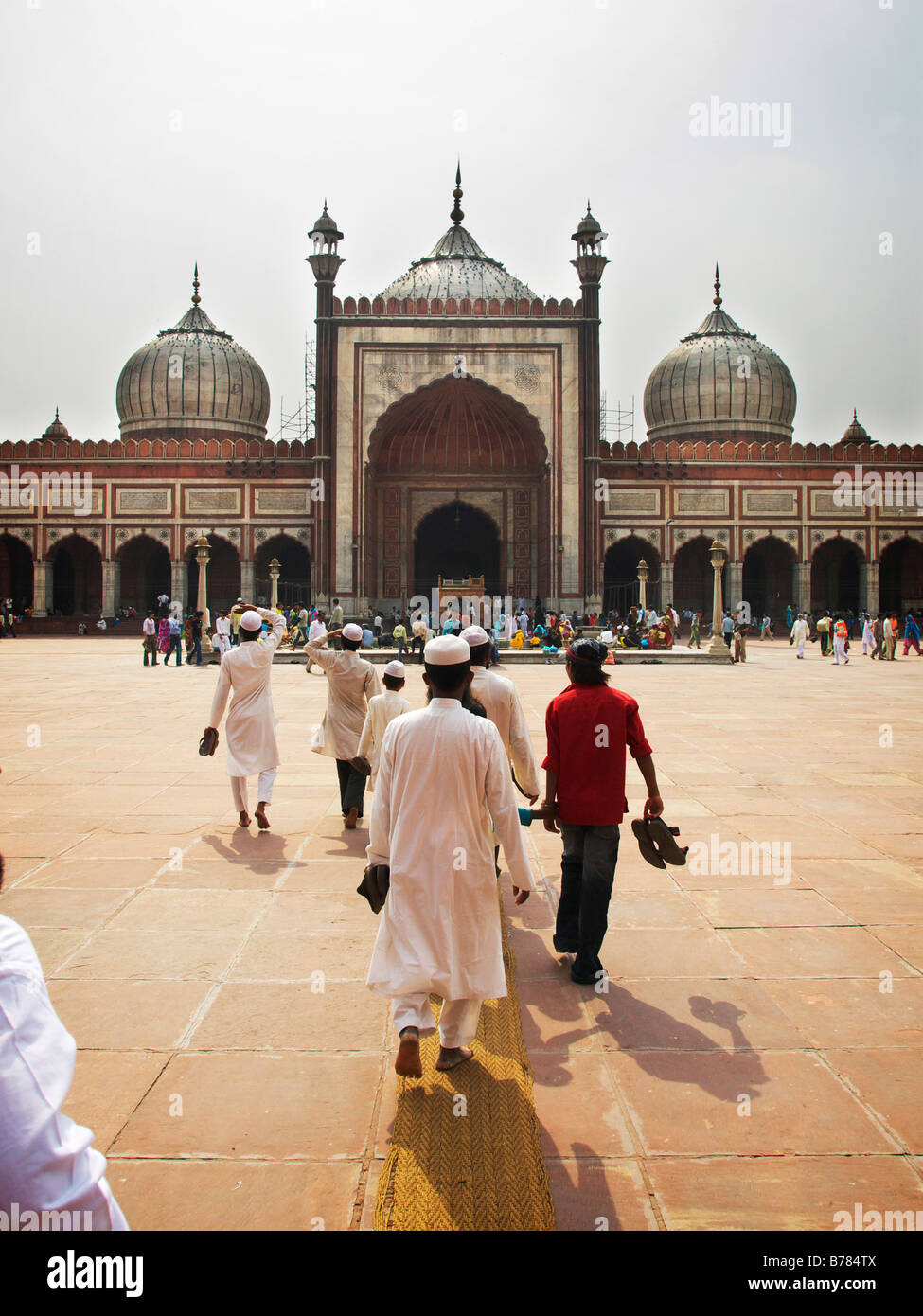 Muslims walking toards Jama Masjid mosque, India, Old Delhi, Stock Photo