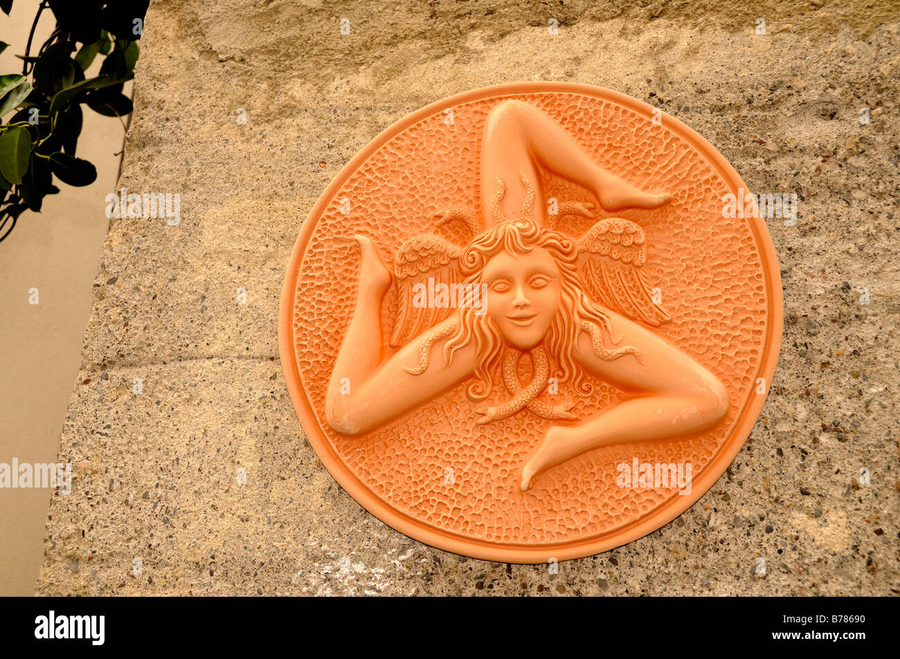 Trinakria or 3 legged woman with her head surrounded by snakes which is