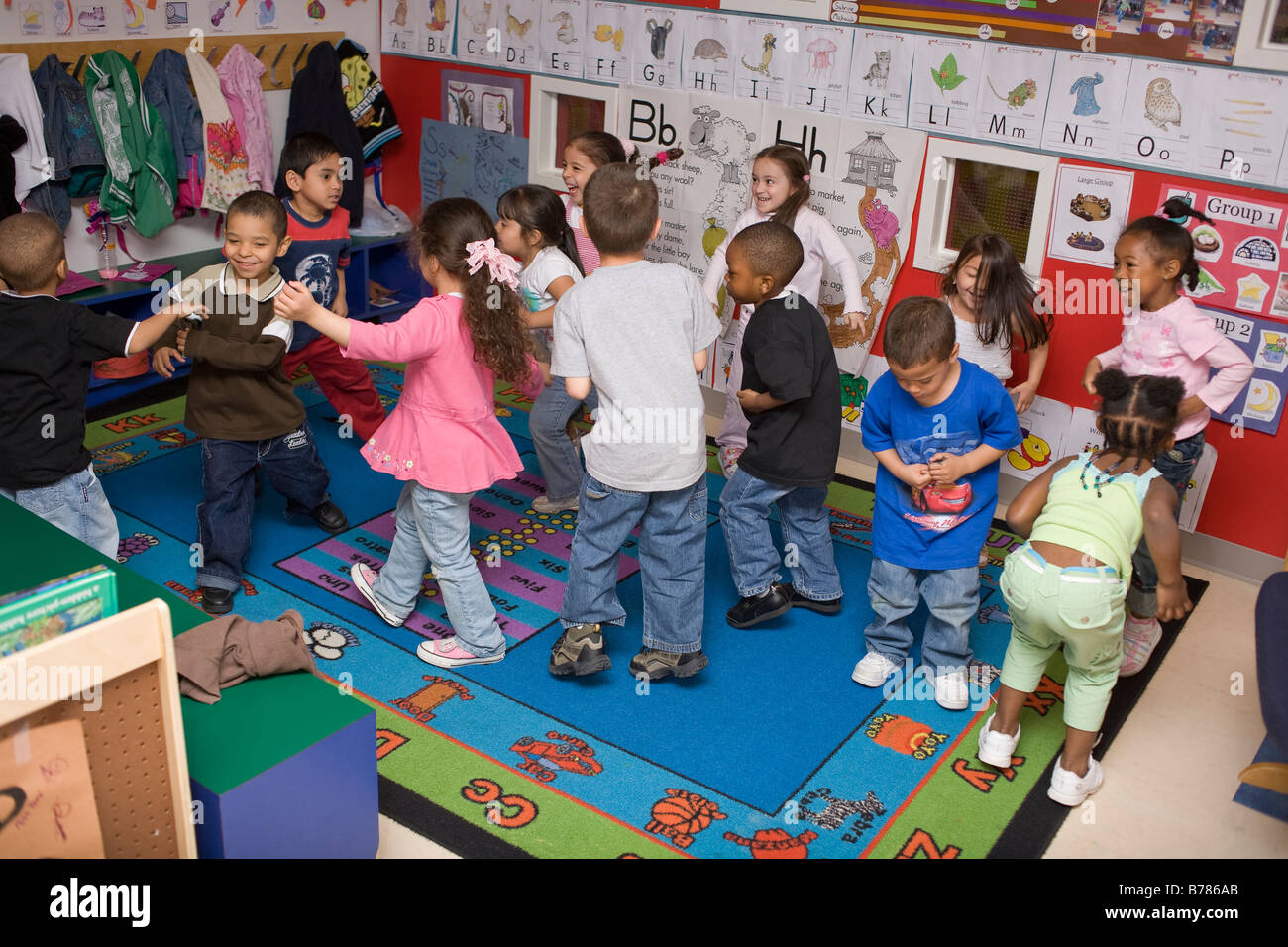 Preschool children dancing in the classroom Stock Photo - Alamy