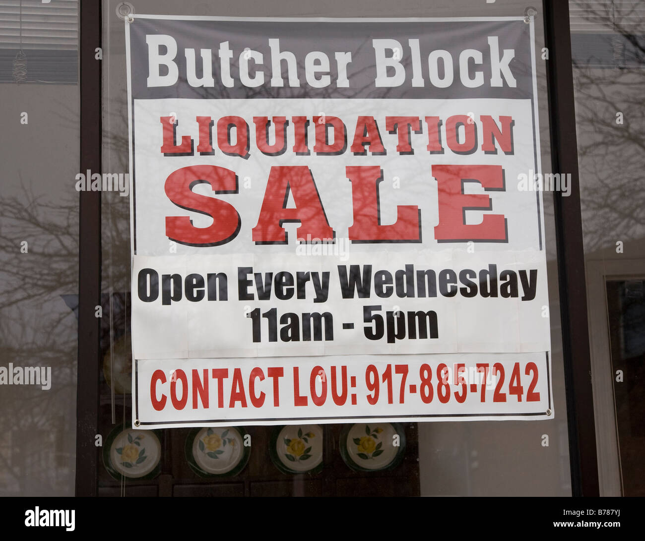 Liquidation sale sign in front of a store Stock Photo