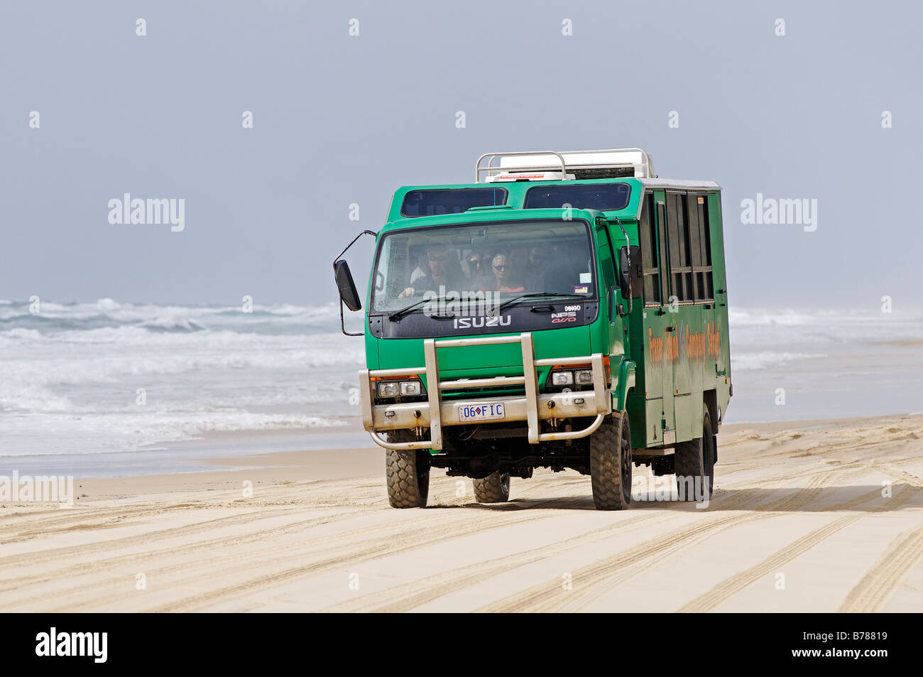Truck with visitors drive on the beach on Fraser Island, Queensland, Australia Stock Photo