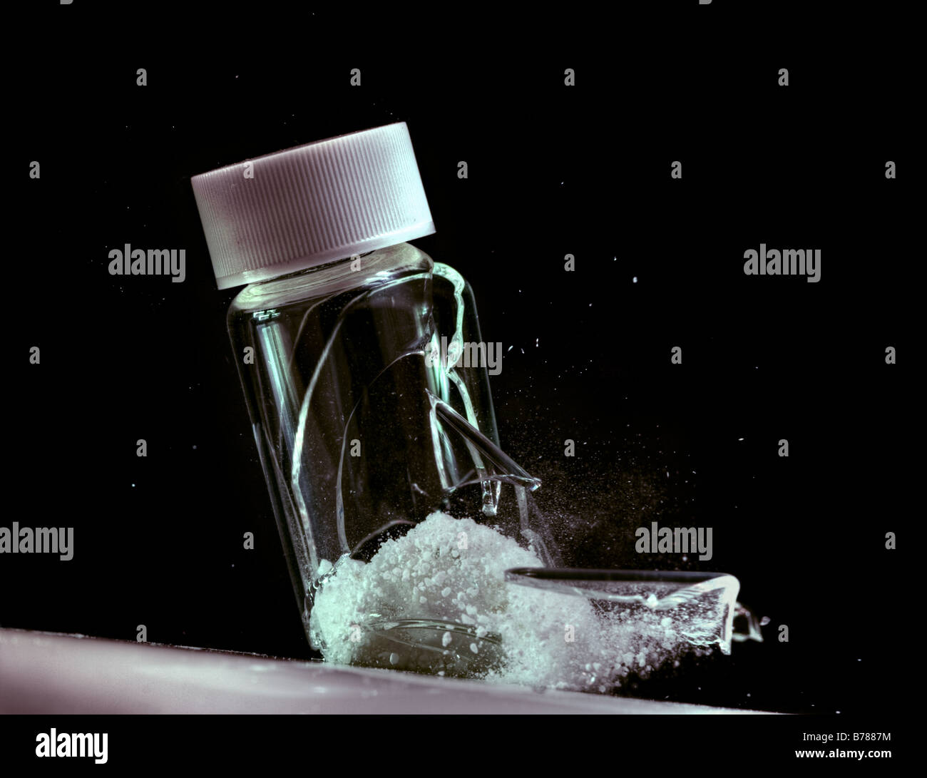 White powder filled vial cracking open Stock Photo Alamy