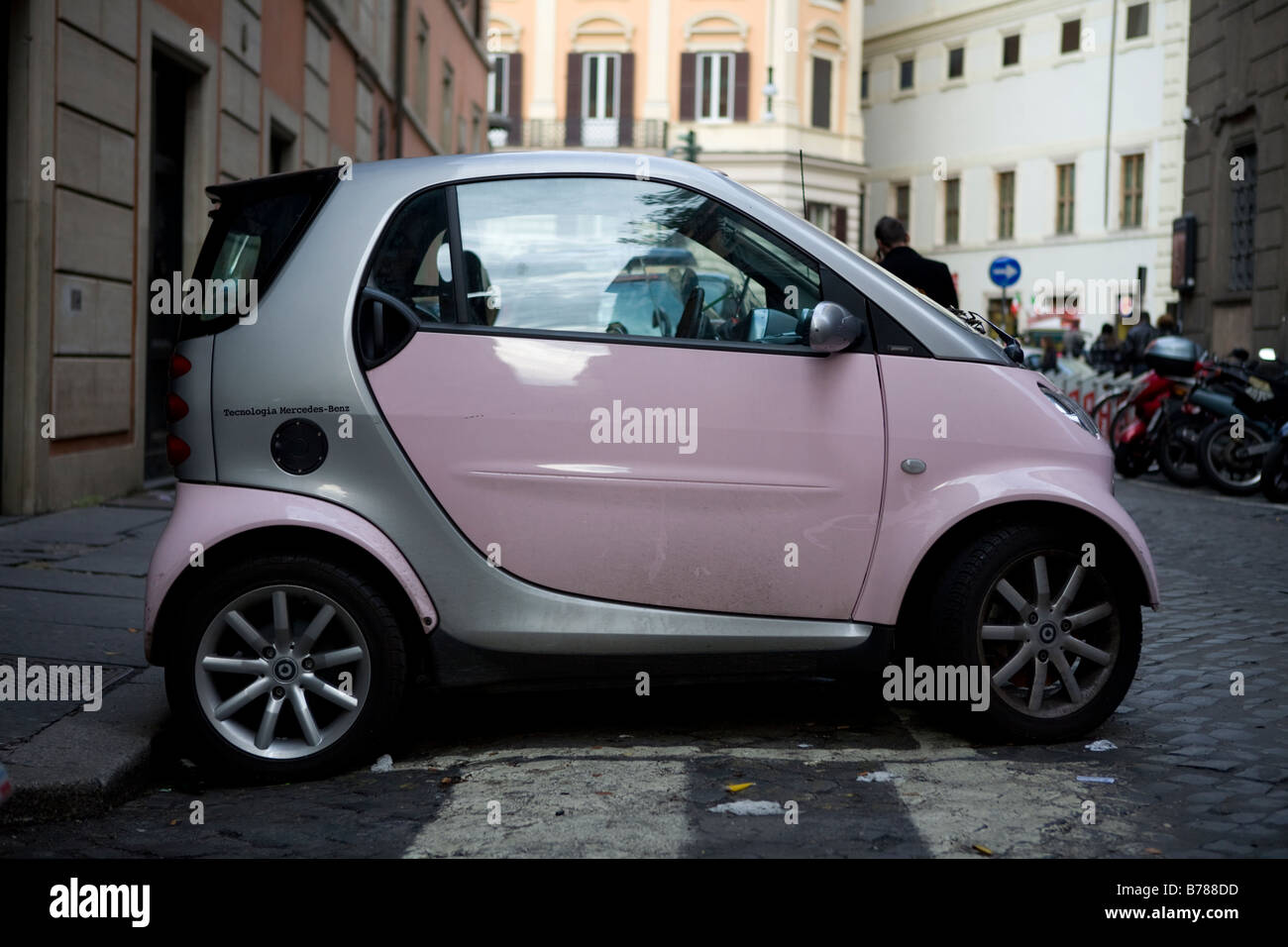 Pink Smart car in Rome italy Stock Photo