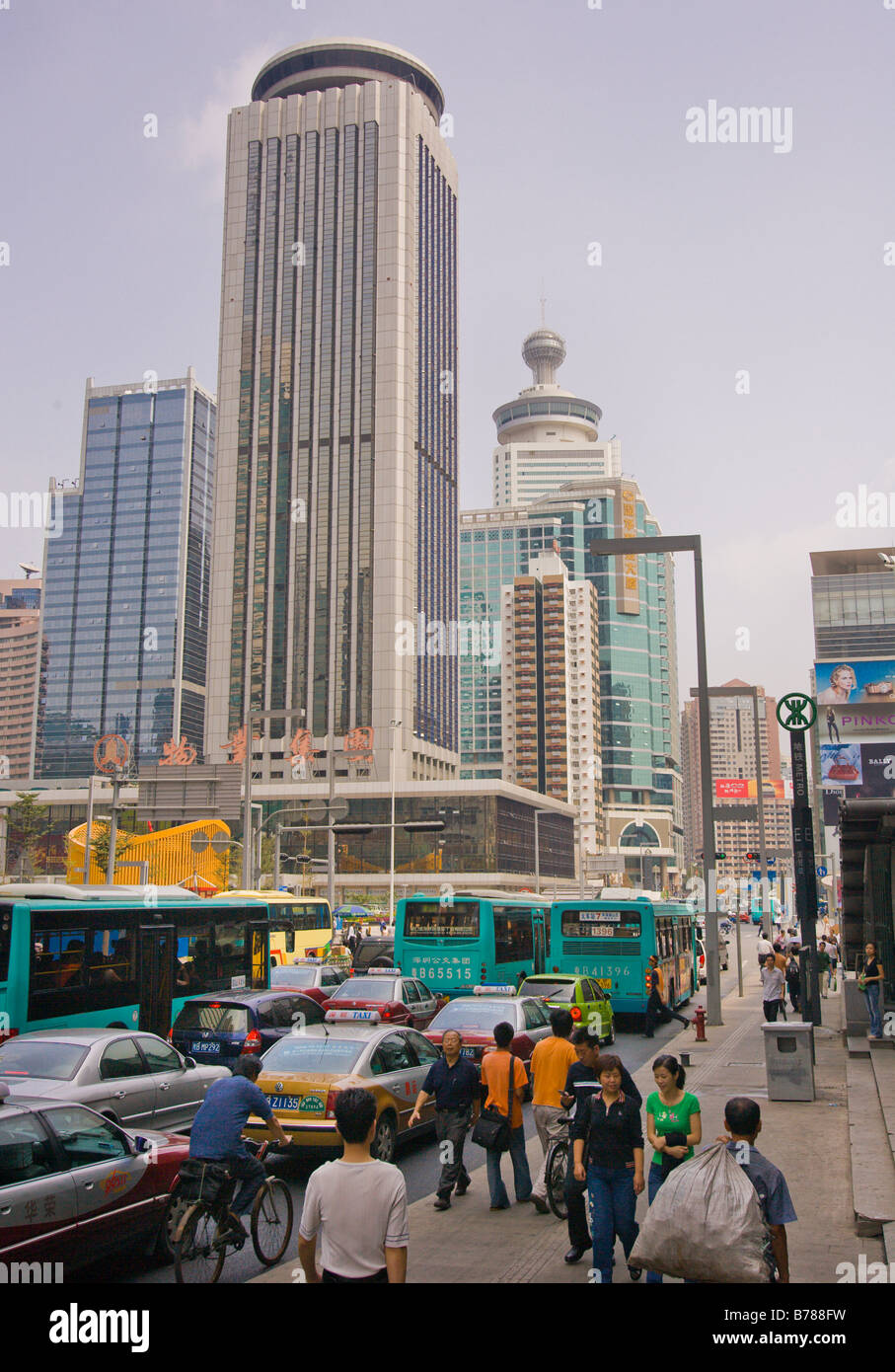 SHENZHEN, GUANGDONG PROVINCE, CHINA - Bustling street scene with people and traffic, in city of Shenzhen. Stock Photo