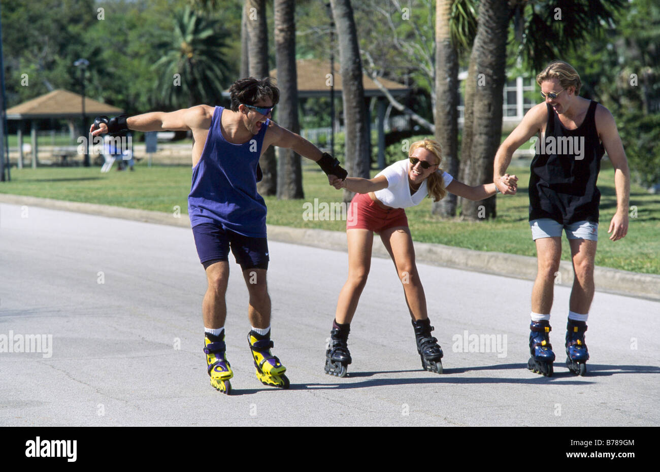 Couple,friends rollerblading in park, Miami Stock Photo - Alamy