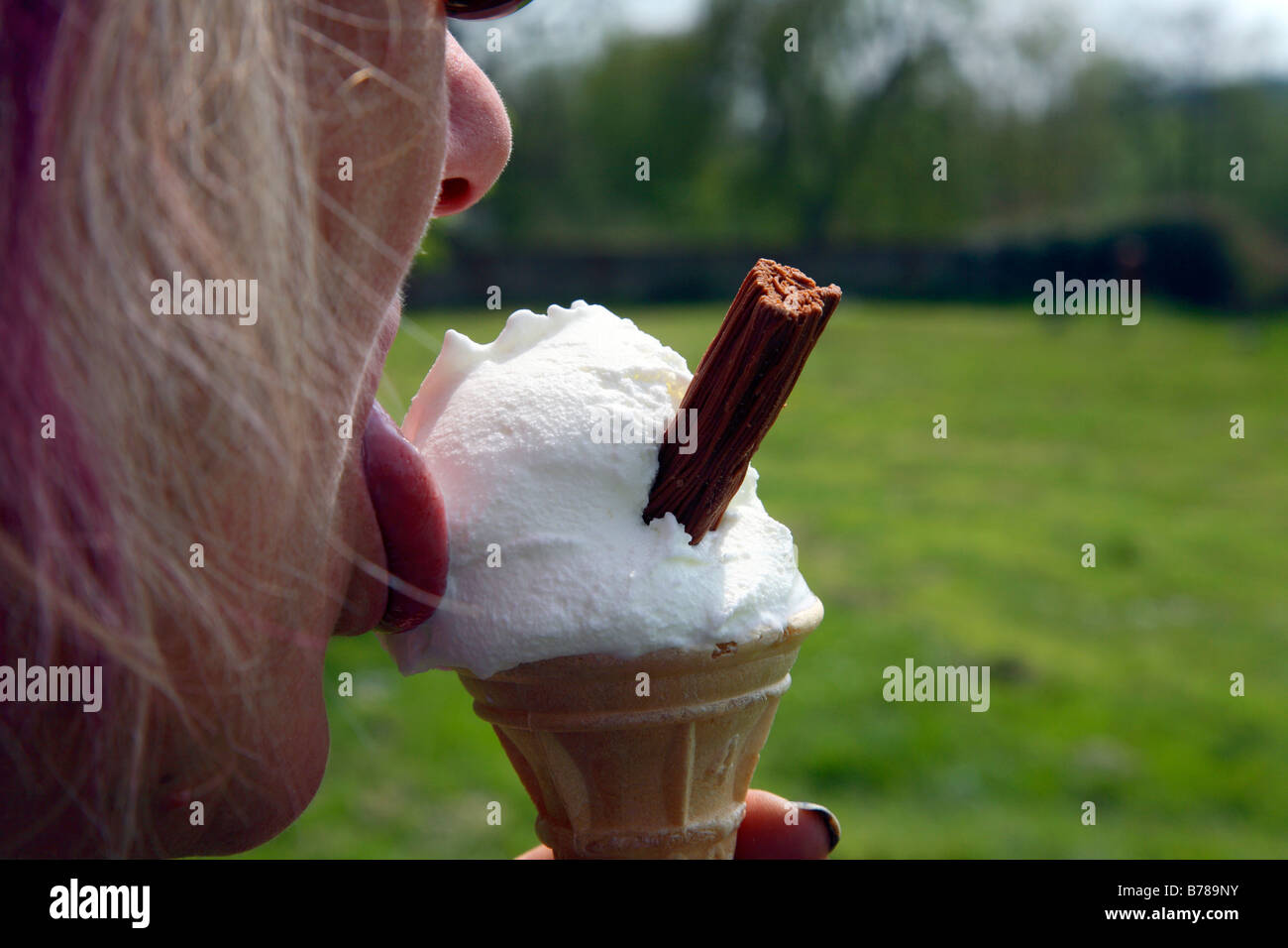 Woman licking ice cream Stock Photo Alamy