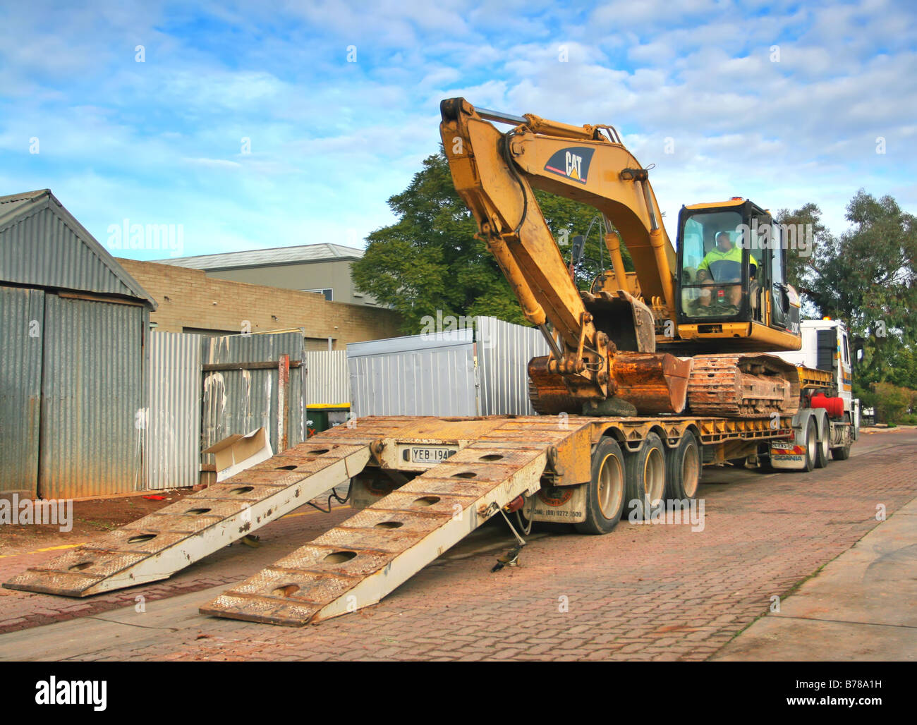 Excavator loading truck hires stock photography and images Alamy