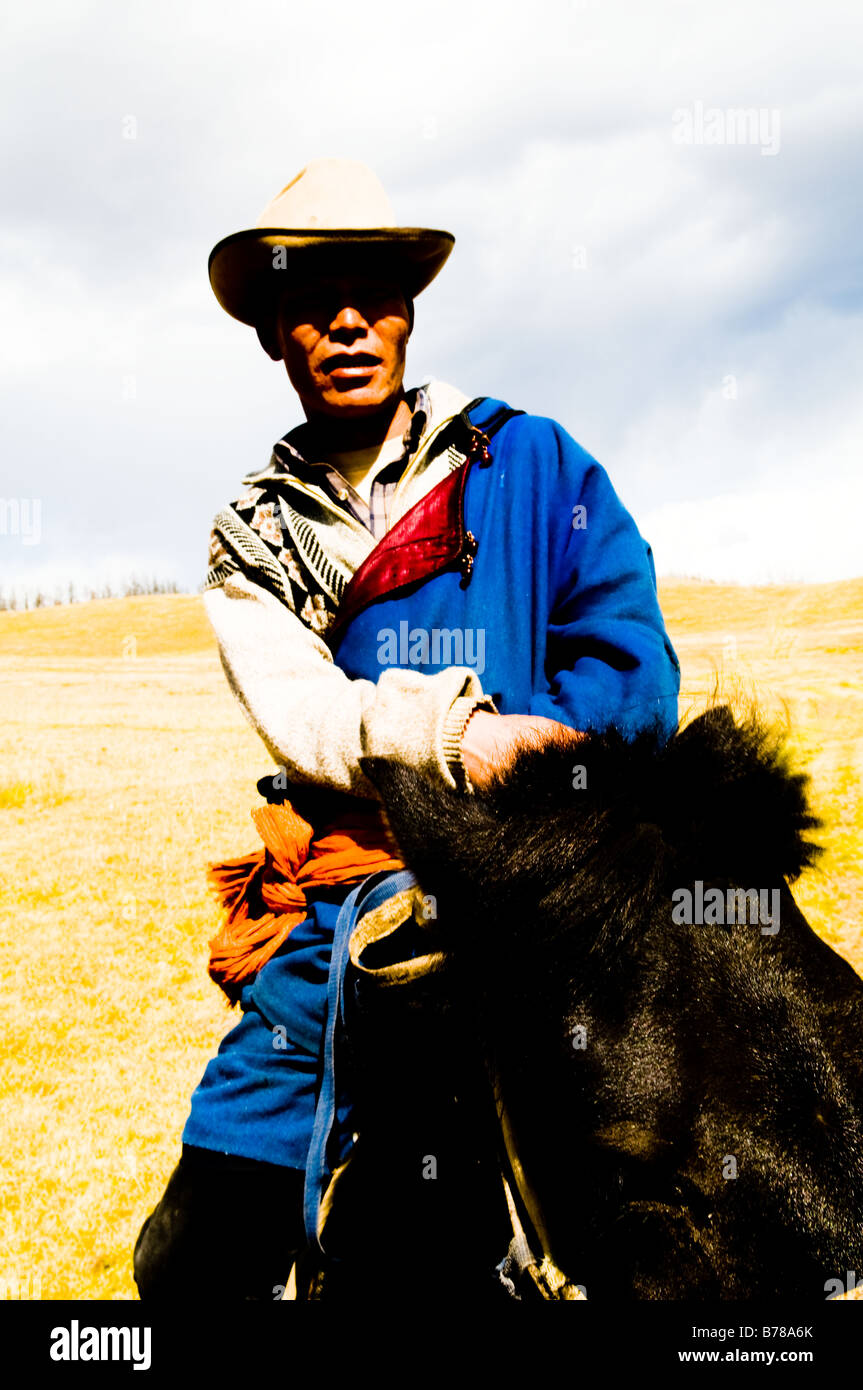 A Mongolian nomad on his horse Stock Photo - Alamy