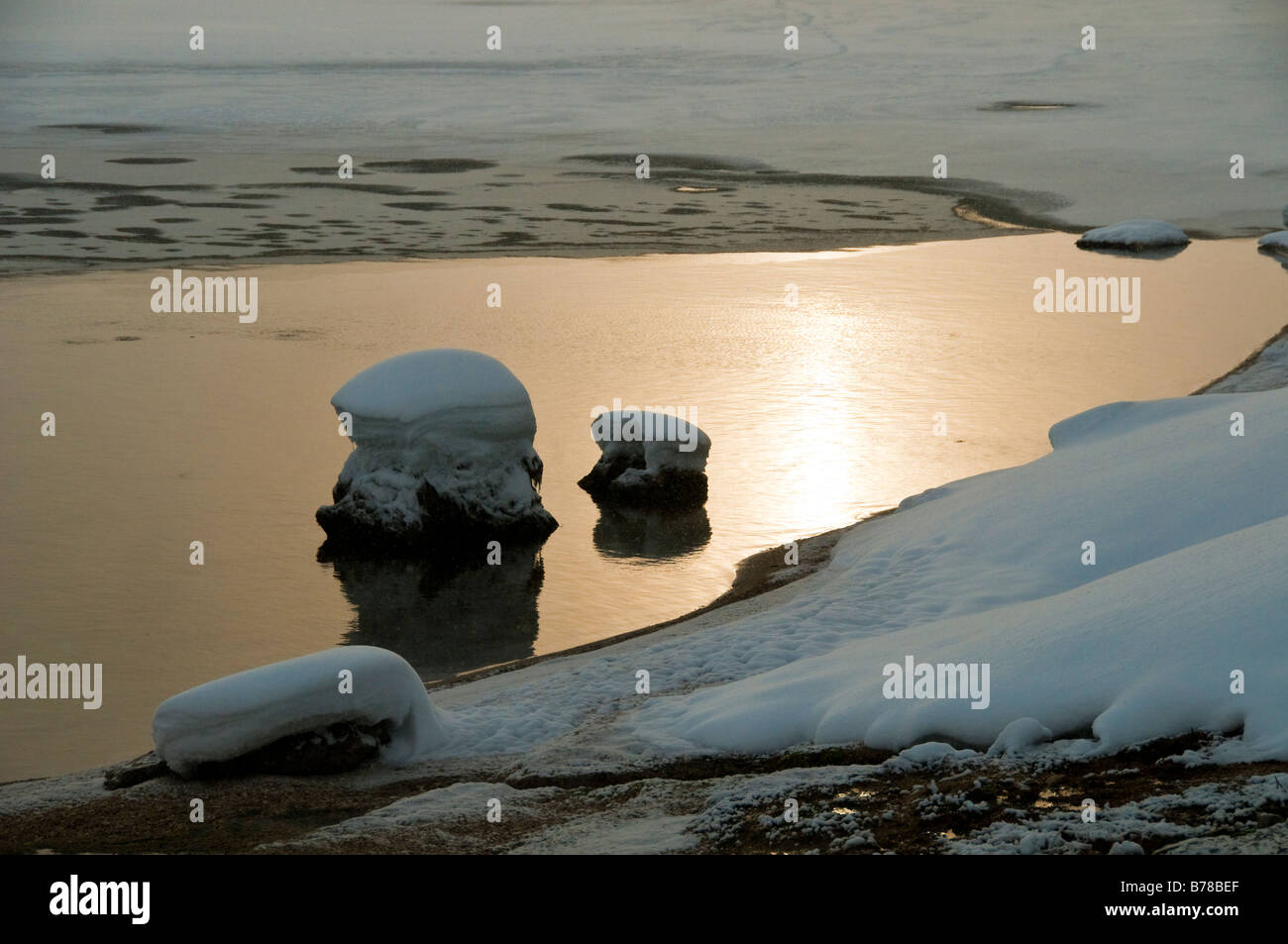 Snow and rocks in Yellowstone Lake, winter, West Thumb Geyser Basin
