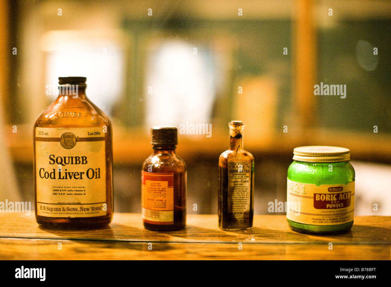 A row of old medicine bottles sits on the ledge at the Sebastiani Theater in Sonoma, CA. Stock Photo