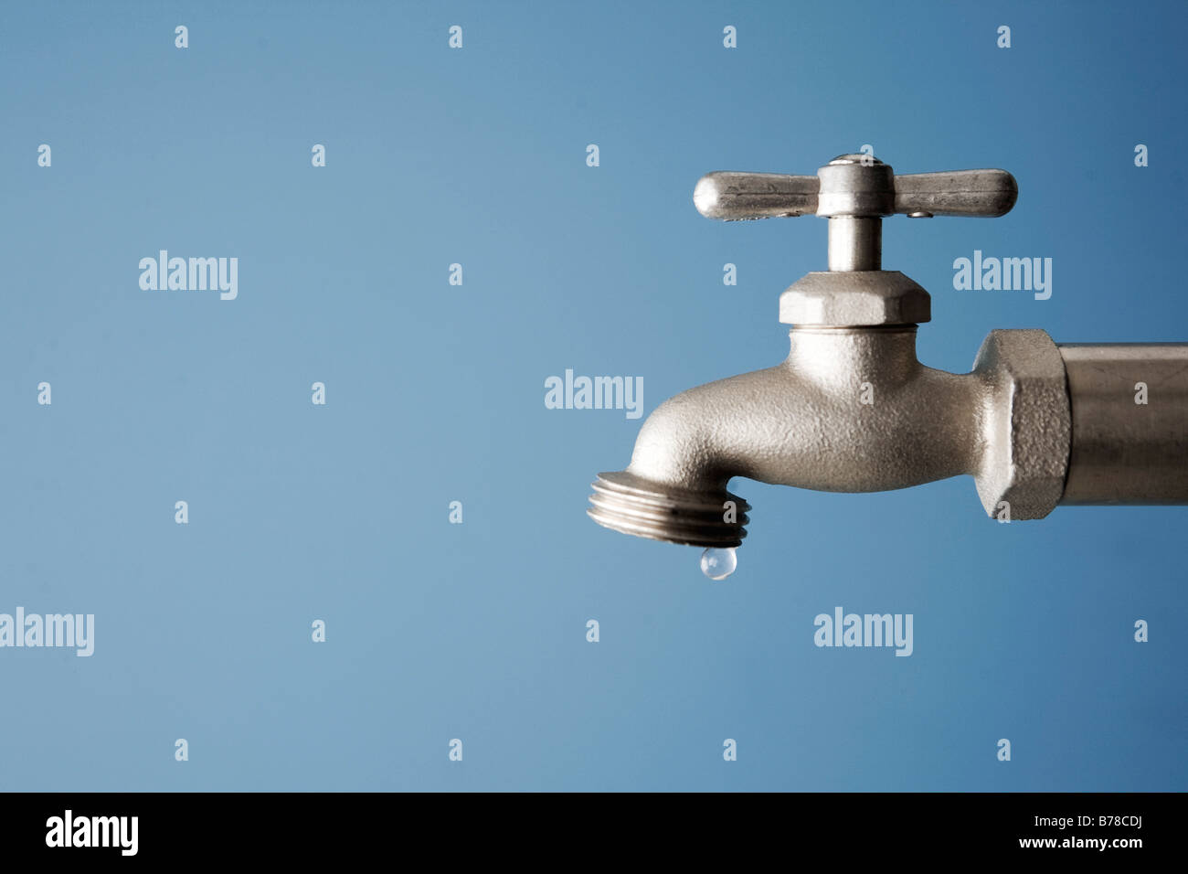 water drips from faucet Stock Photo