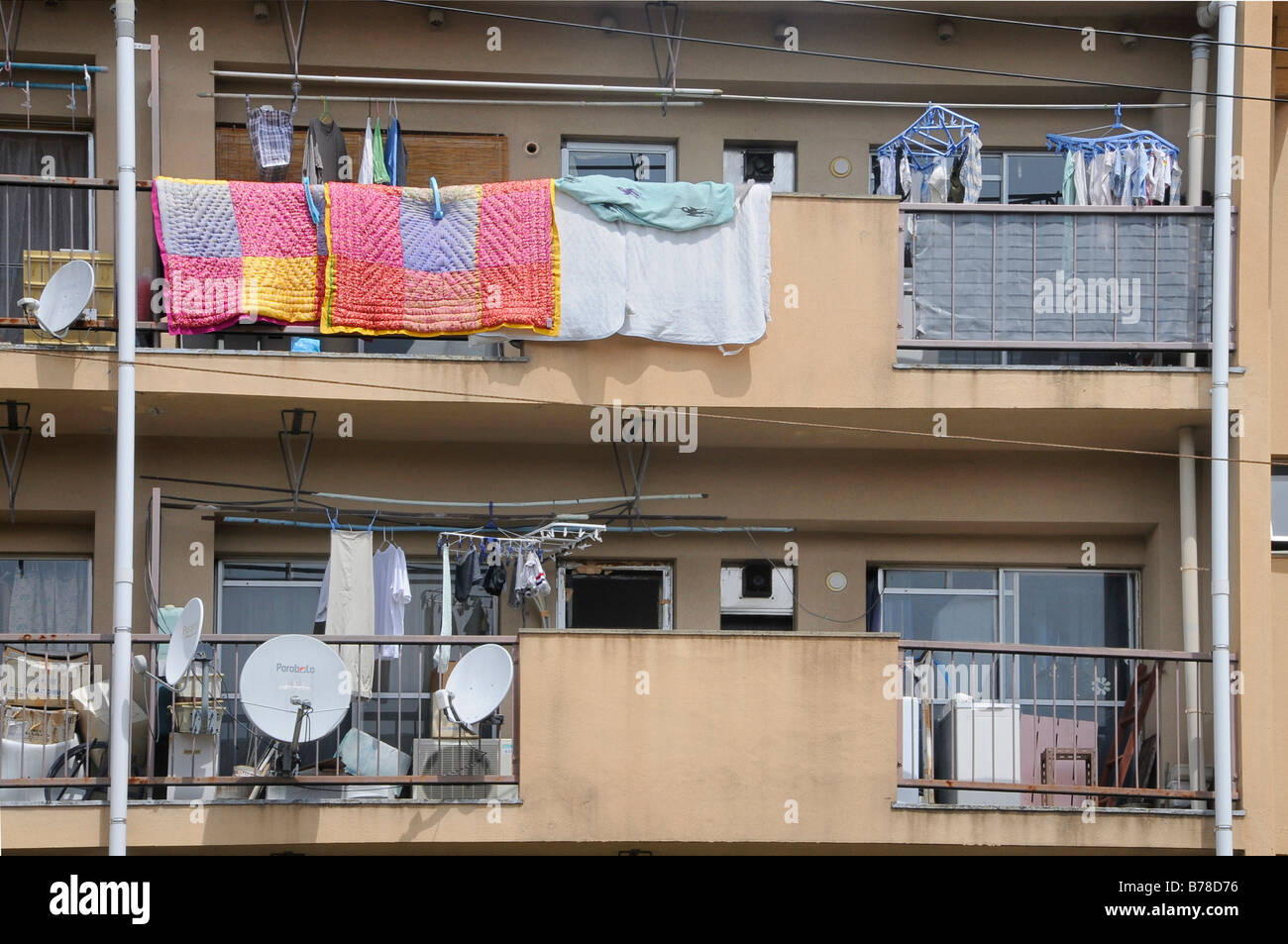 Typical use of balconies as roofed clothes dryers, storage space, with