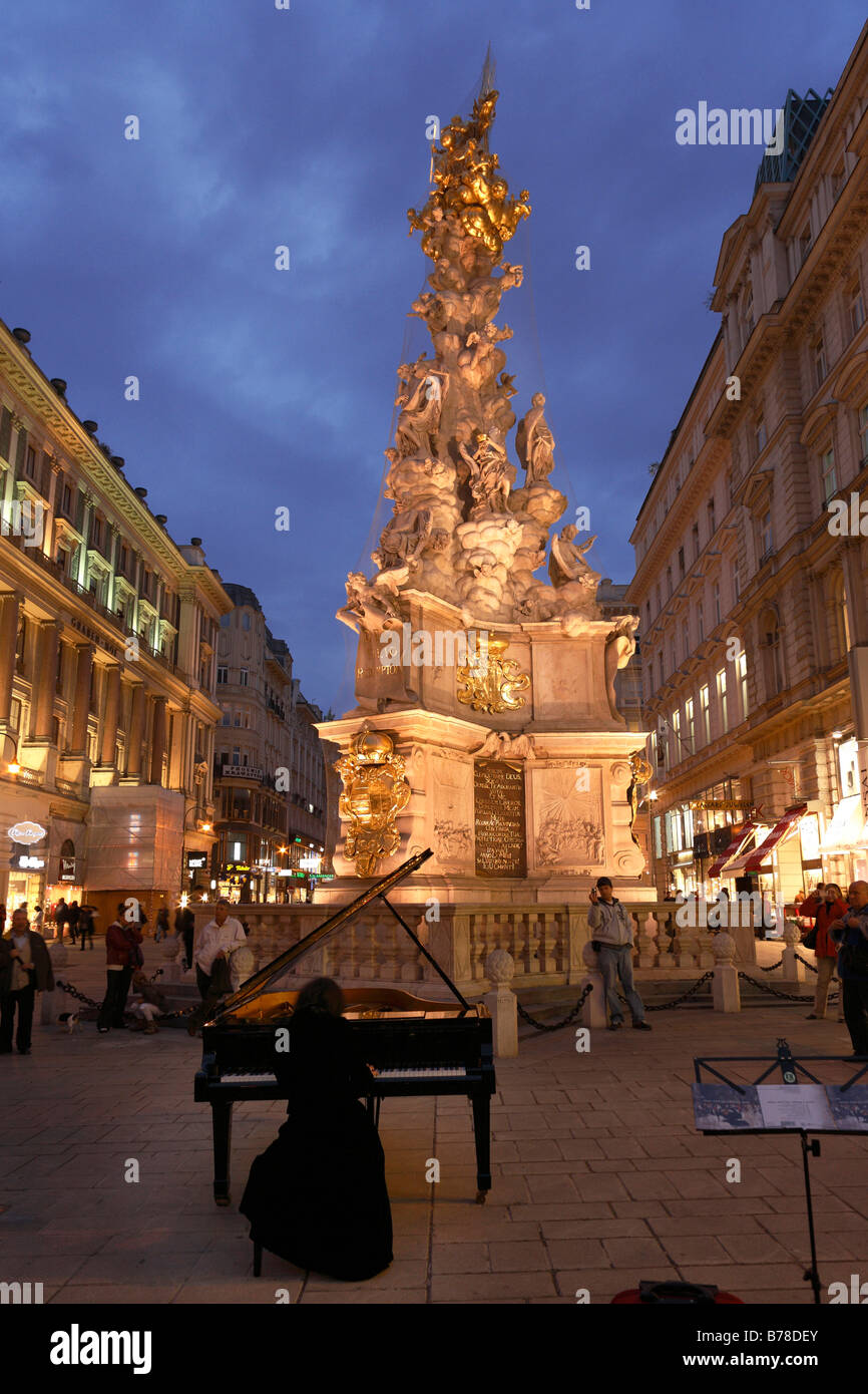 Pestsaeule, Dreifaltigkeitssaeule, and pianist SoRyang on the grand piano in Graben, city, Vienna, Austria, Europe Stock Photo