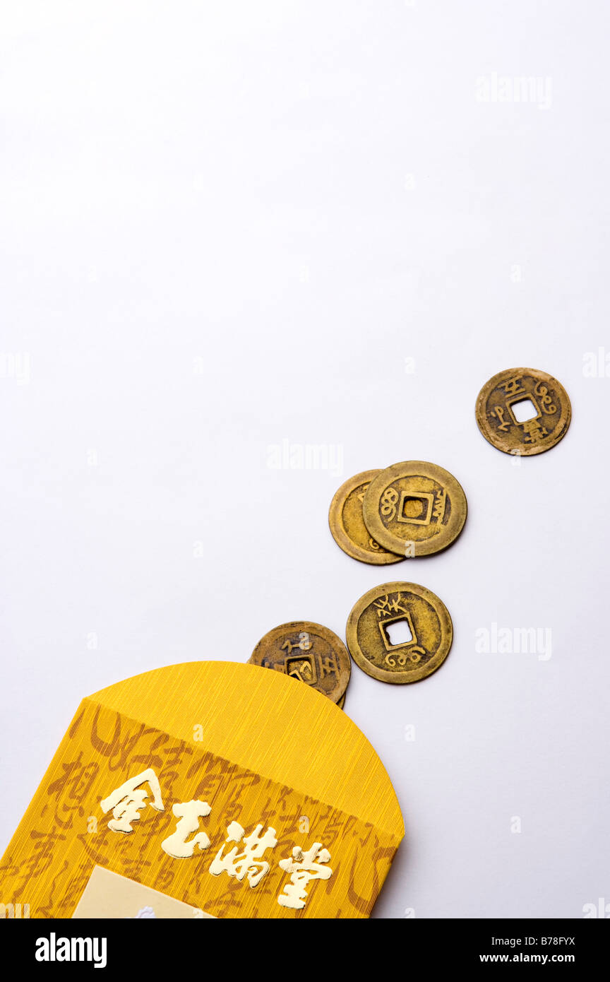 Close-up of Chinese coin with paper bag Stock Photo