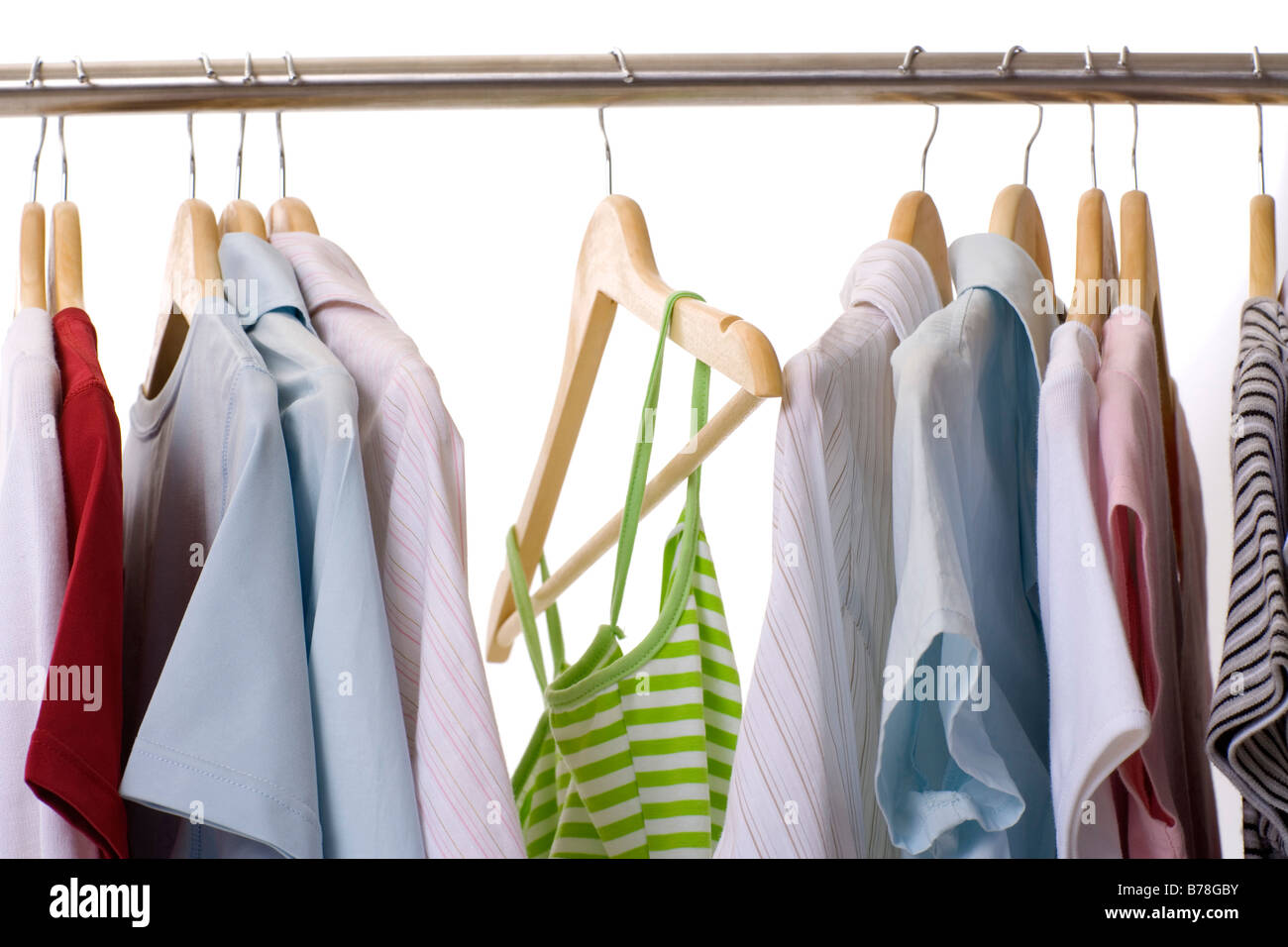 Clothing hanging on hangers Stock Photo Alamy