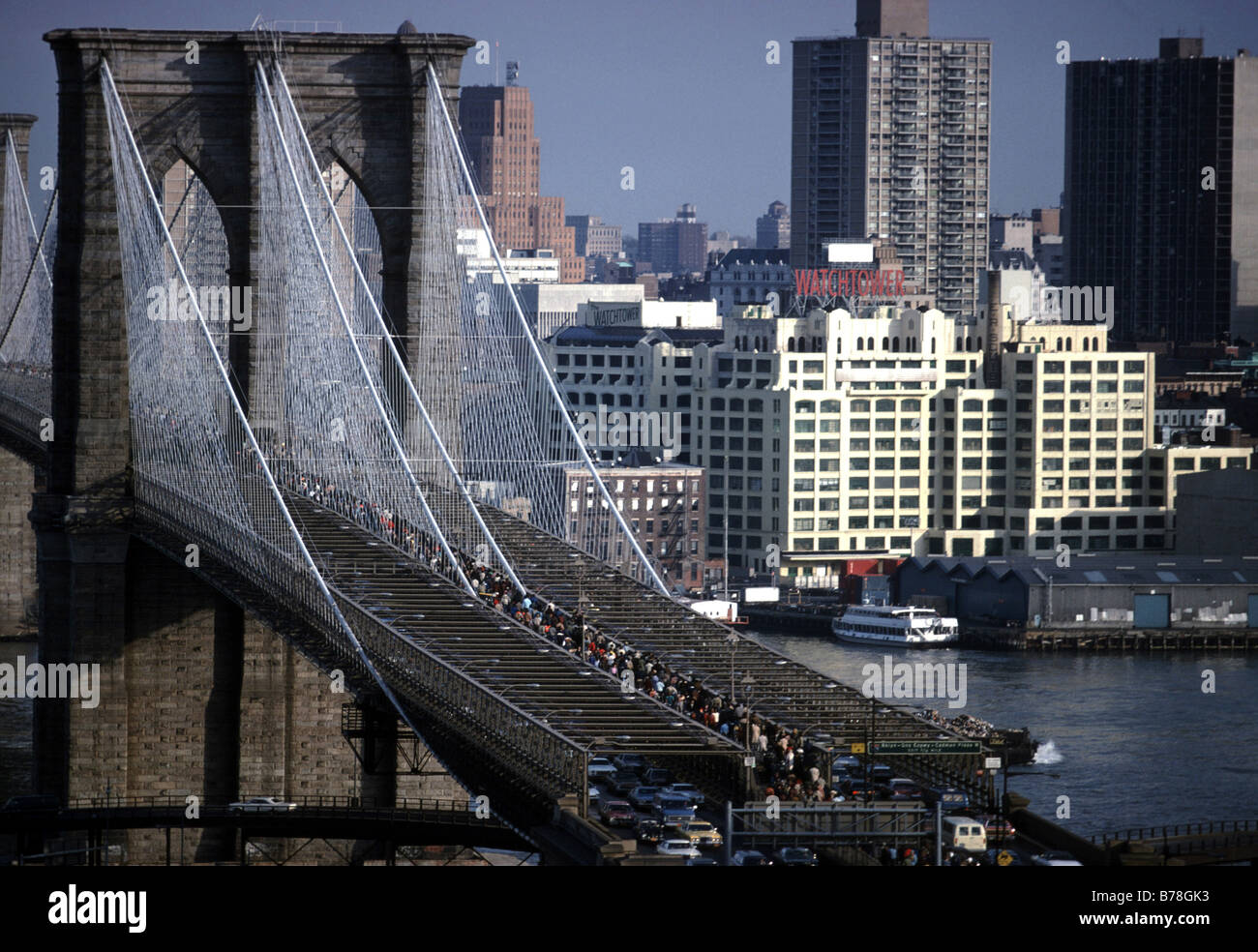 commuters walking over the Brooklyn Bridge,to and from Manhattan,at
