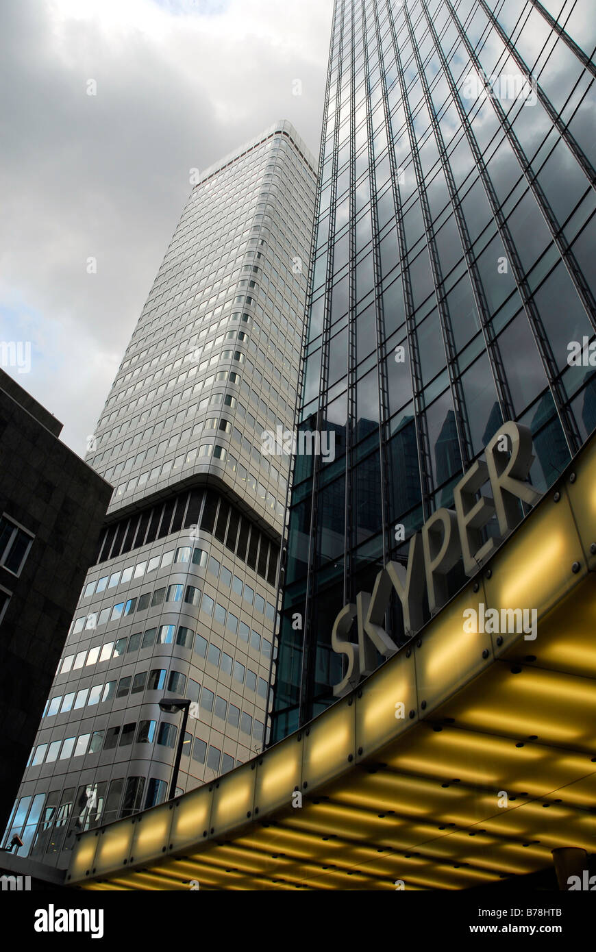 Grey clouds reflecting in the glass front of Skyper building and Dresdner Bank in the banking district, Frankfurt am Main, Hess Stock Photo
