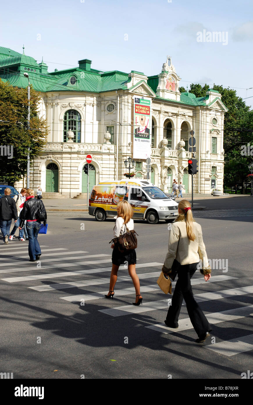 National theatre, Nacionalais teatris, pedestrians on the crosswalk, in the Kr. Valdemara iela street, Riga, Latvia, Baltic Sta Stock Photo
