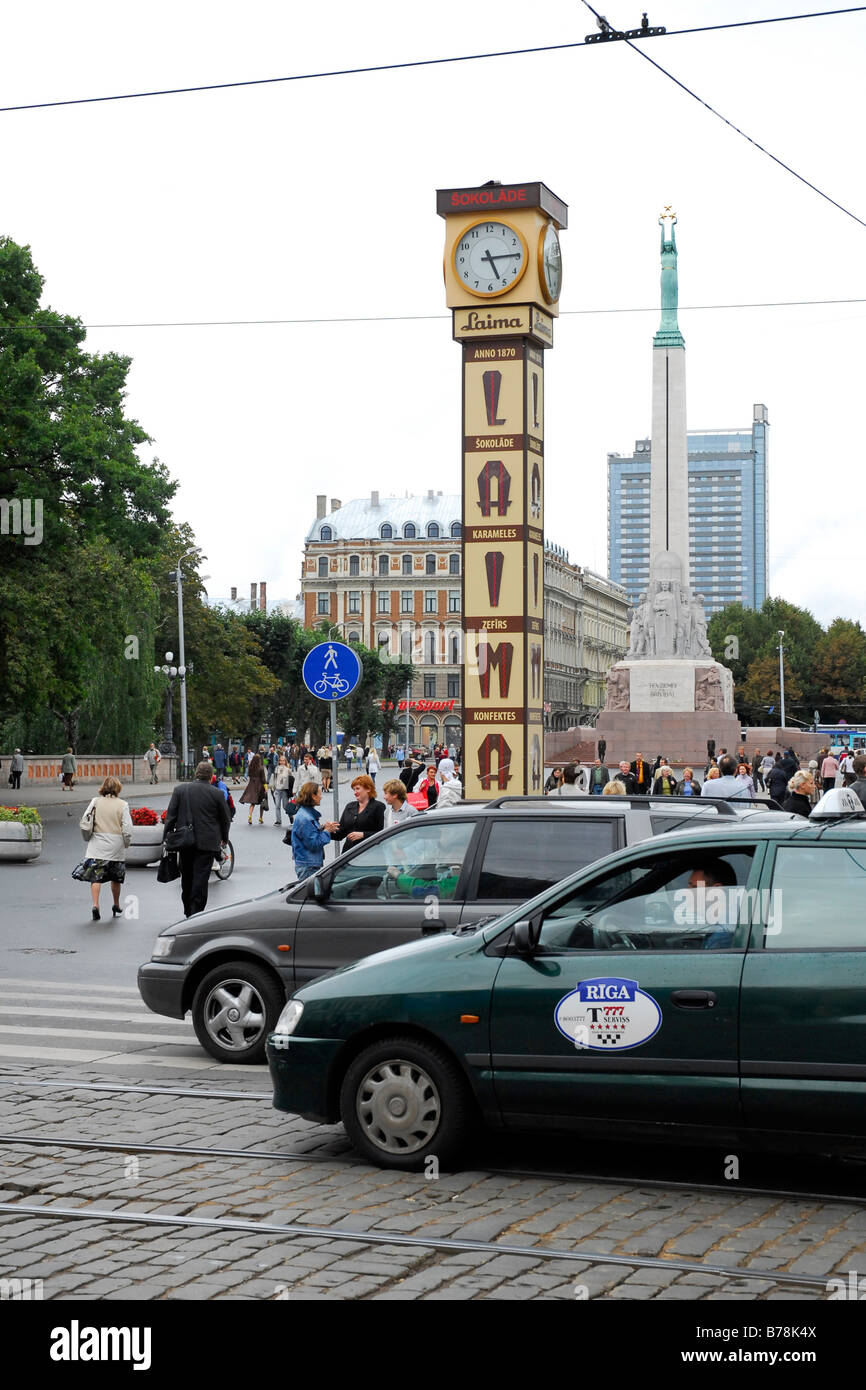 View along Brivibas bulvaris Boulevard, in the foreground in the Aspazijas bulvaris boulevard the Laima Clock from 1924, advert Stock Photo