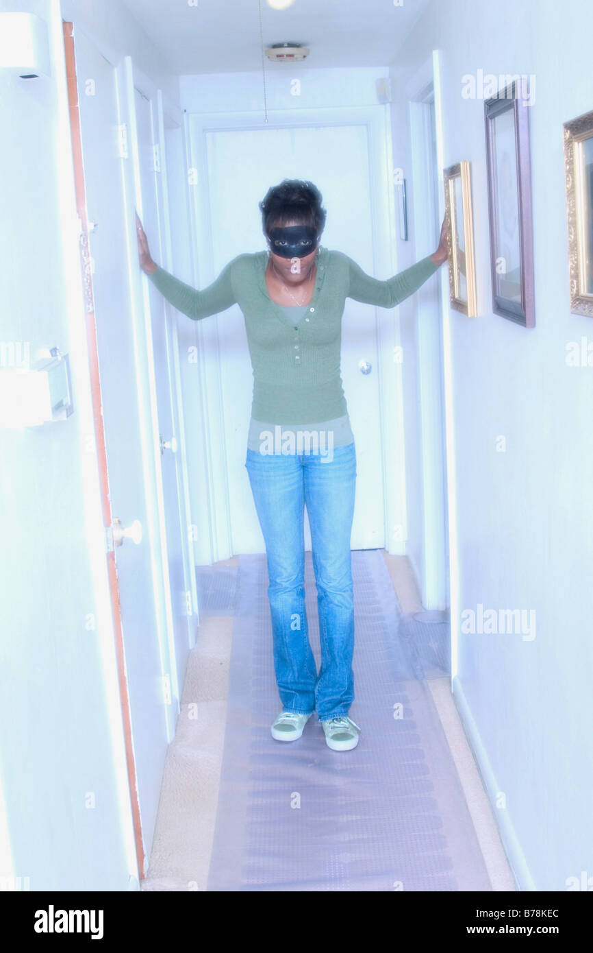 Woman with mask and black costume hi-res stock photography and images ...