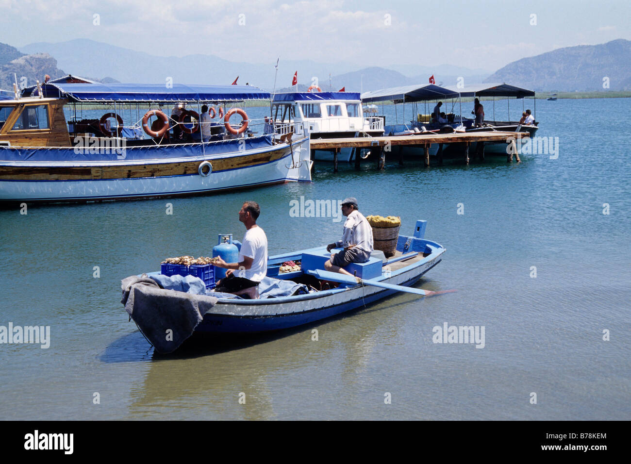 Seafood vendors, boats on the river, river delta near Kaunos, Dalyan in the Mugla Province, Turkey Stock Photo