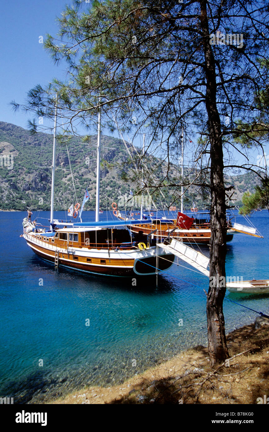 Cleopatra Hamami Bay, ancient bathing resort, yachts in the Bay of Fethiye, Mugla Province, Mediterranean, Turkey Stock Photo