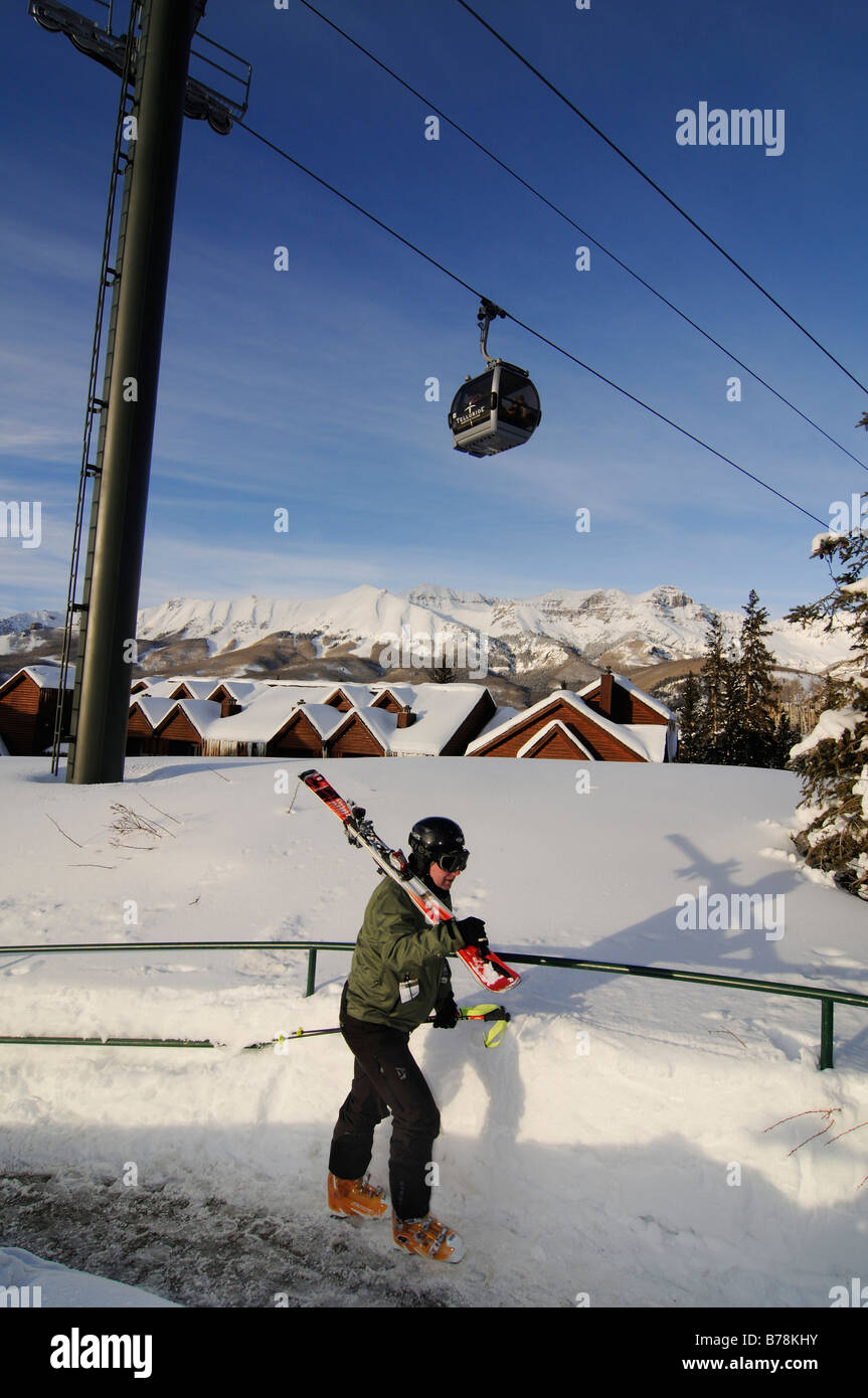 Skier in Mountain Village beneath the gondola lift, ski region Telluride in Colorado, USA, North