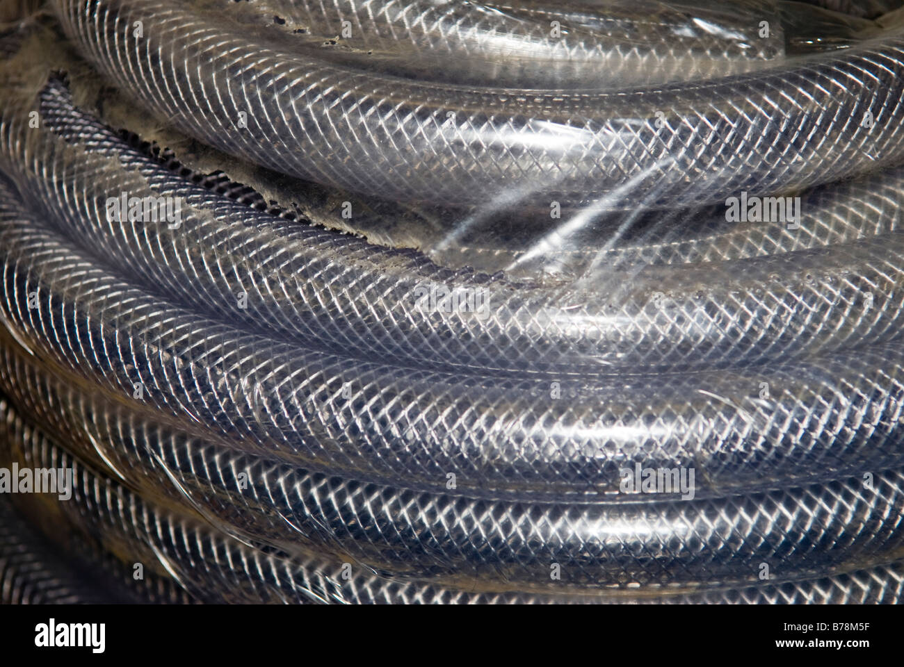 Coiled metal tubing, (full frame), close-up Stock Photo