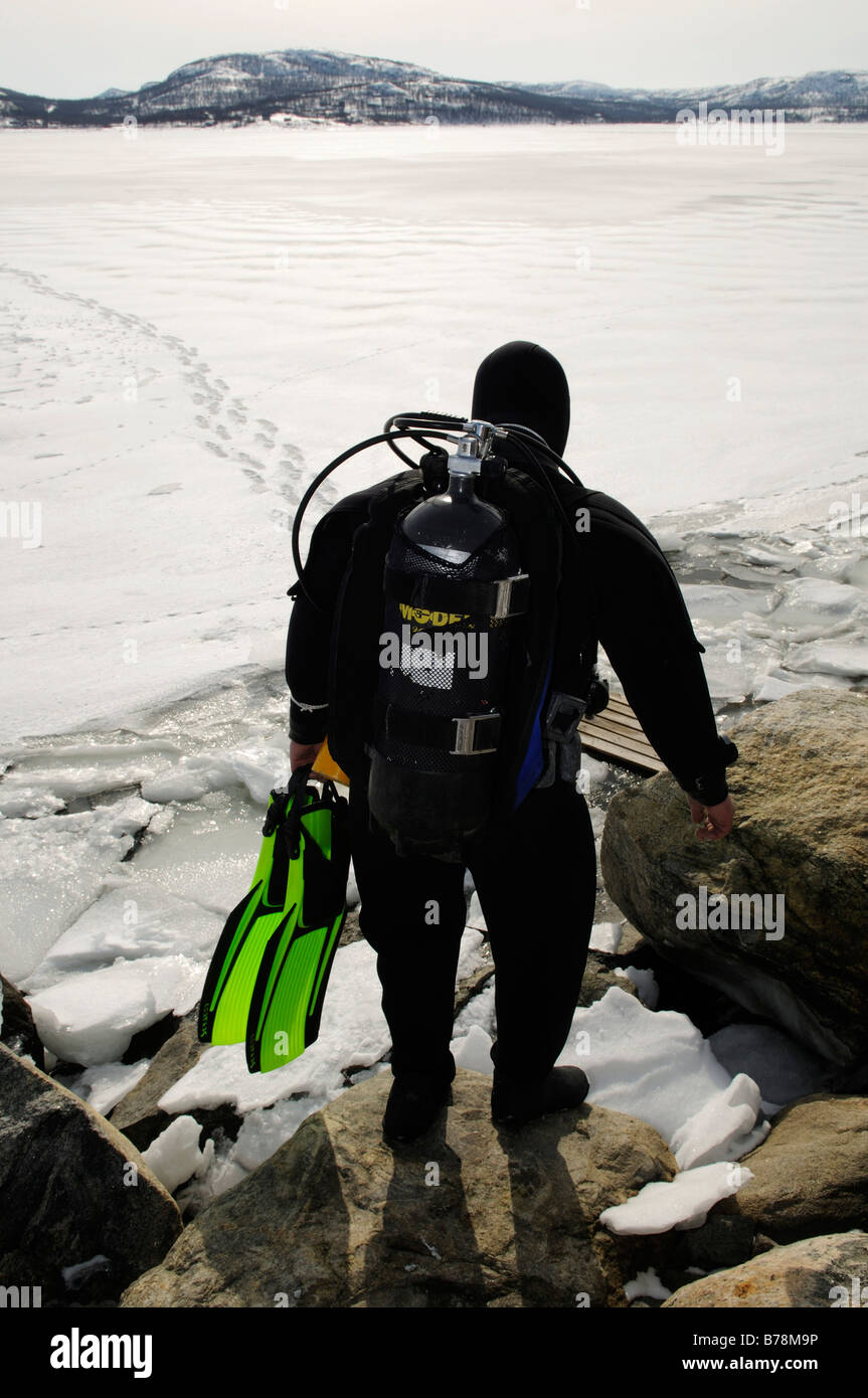 Scuba diver before diving in the fjord for king crabs, Kirkenes