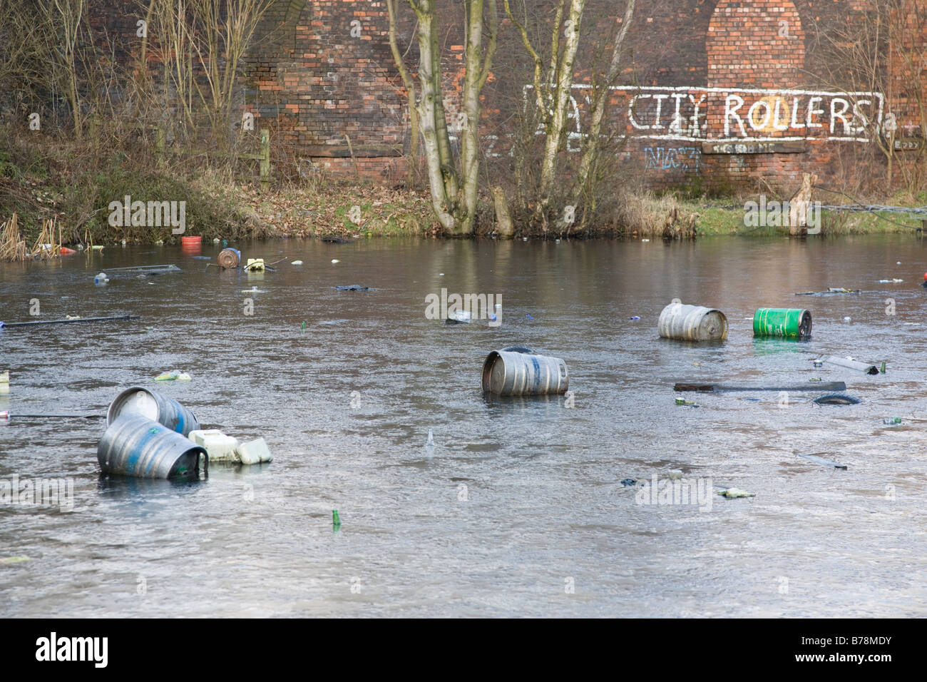 frozen lake with rubbish floating Stock Photo