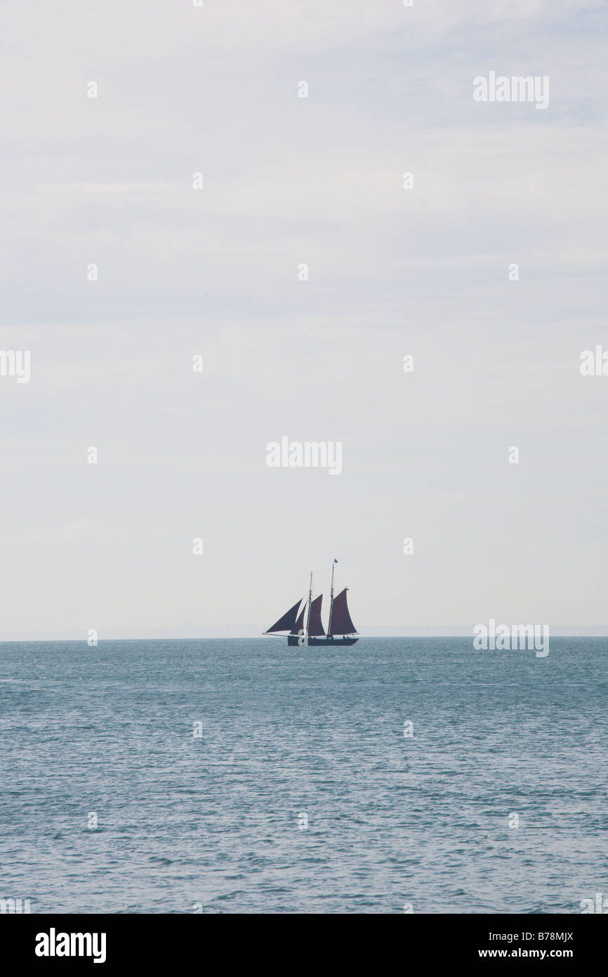 Sailing yacht on blue ocean Stock Photo