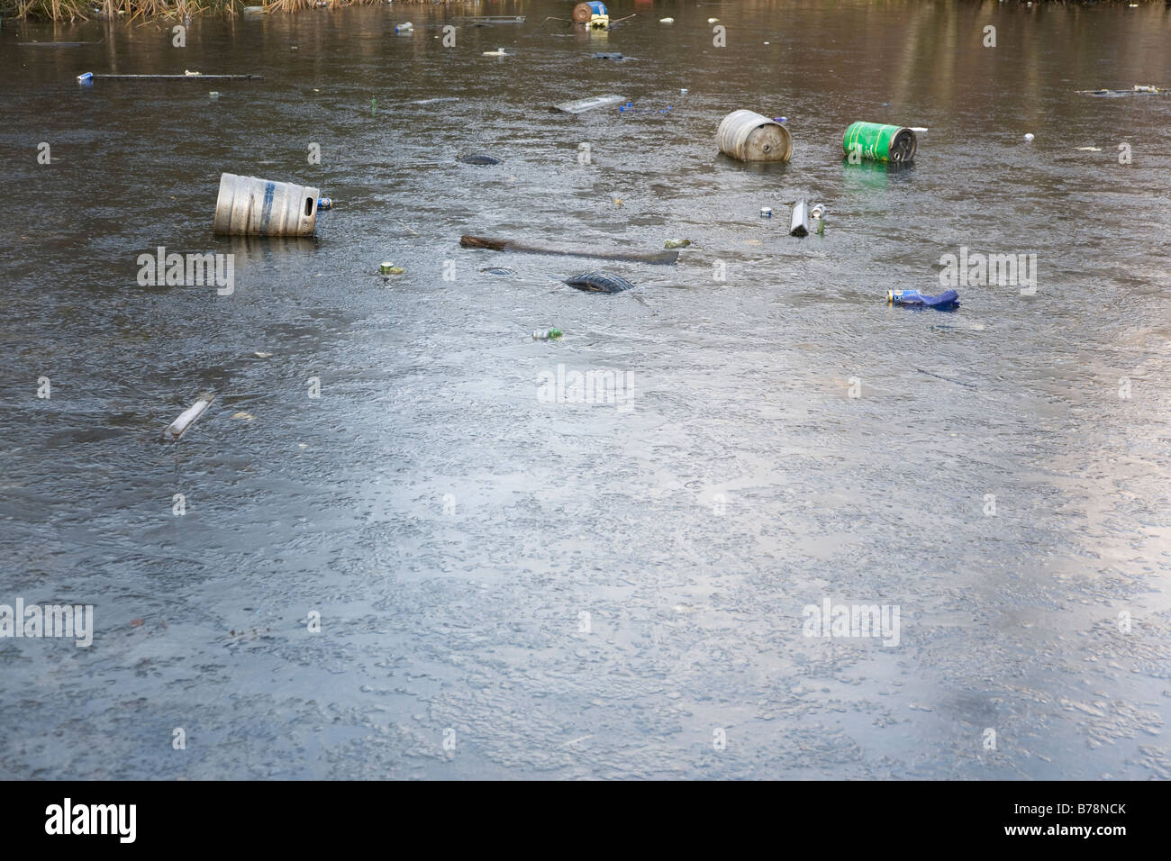 frozen lake with rubbish floating Stock Photo