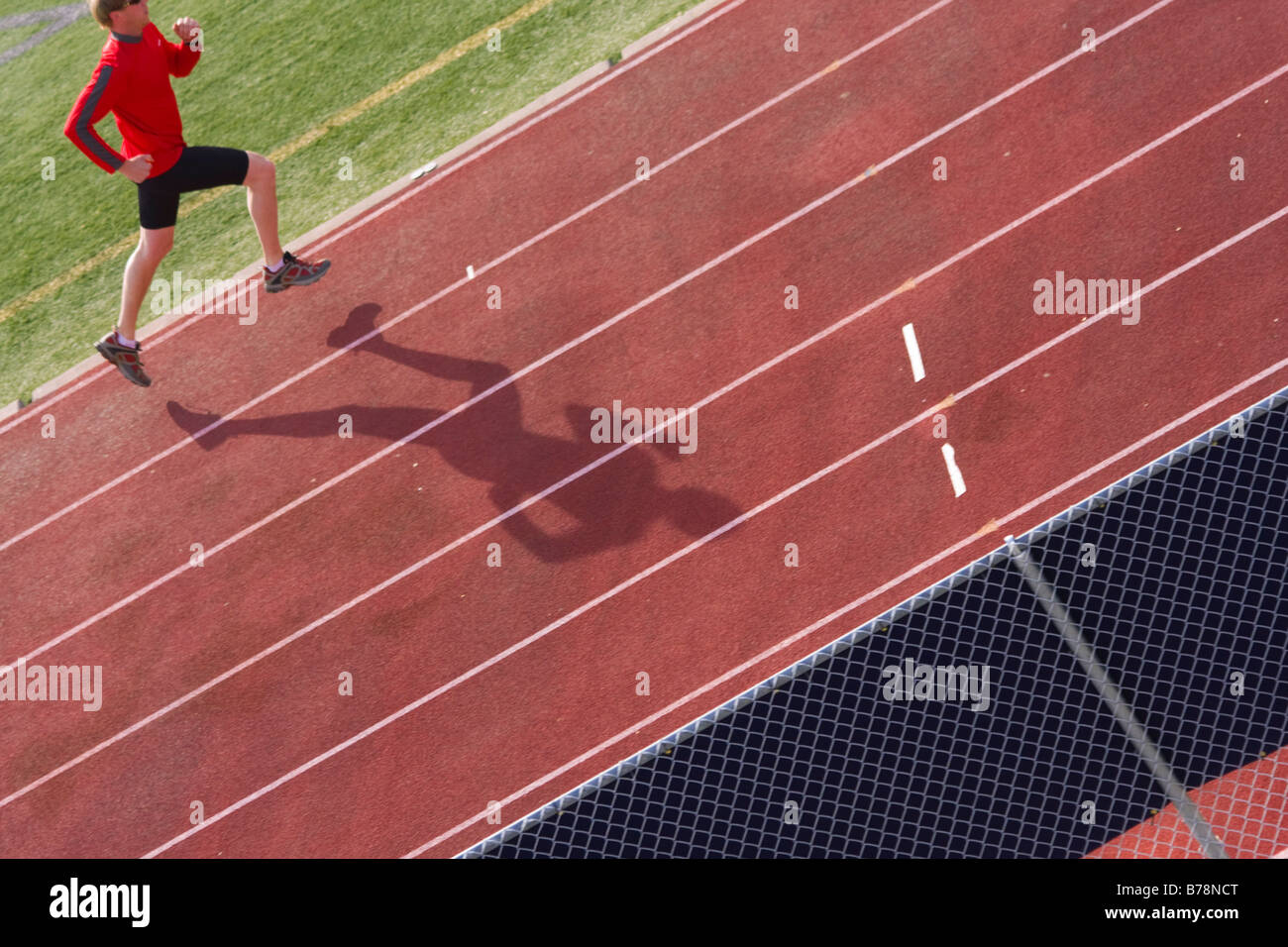 A man running on a track while training in Reno in Nevada Stock Photo